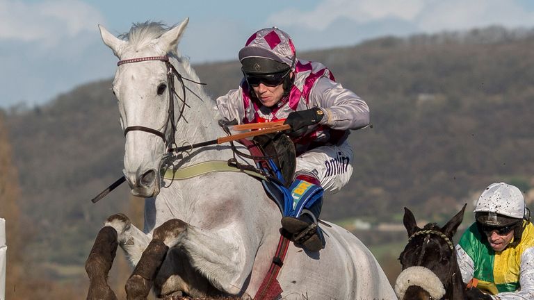 Smad Place ridden by Richard Johnson leads Many Clouds ridden by Leighton Aspell over the last fence before going on to win The BetBright Trial Steeple Cha