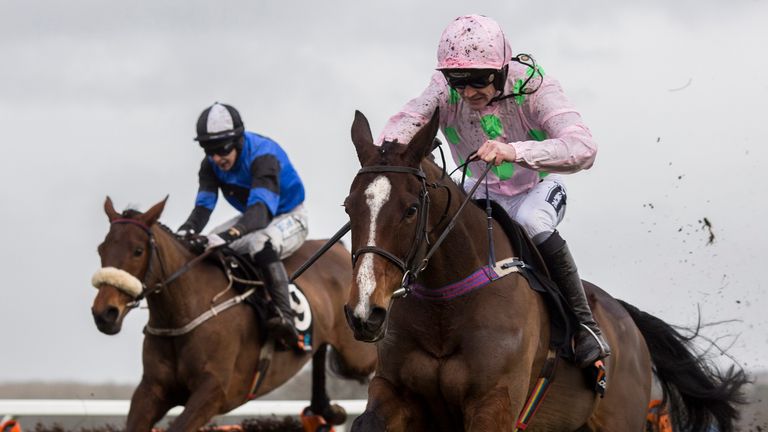 Vroum Vroum Mag ridden by Ruby Walsh clear the last flight from Jennies Jewel on their way to winning the OLBG.Com Mares' Hurdle at Ascot.