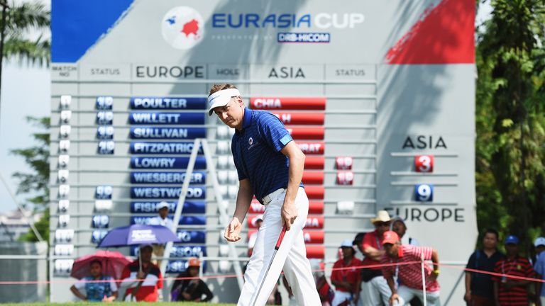  Ian Poulter of team Europe holes his winning putt during the final day's singles matches at the EurAsia Cup