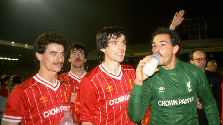 1984:  (From left to right) Ian Rush, Alan Hansen and Bruce Grobbelaar of Liverpool recover after the Milk Cup Final against Everton at Wembley Stadium in 