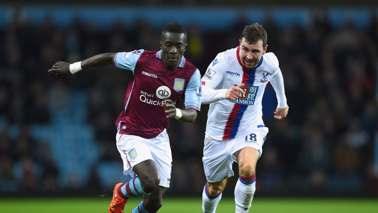 Idrissa Gueye of Aston Villa is chased by James McArthur of Crystal Palace
