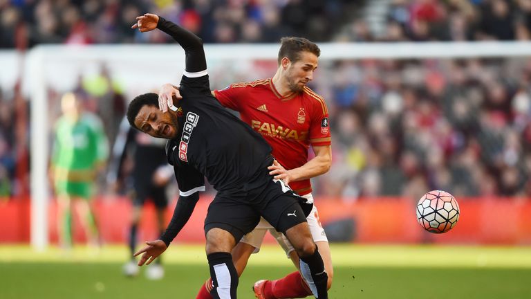 Ikechi Anya of Watford and Chris Cohen of Nottingham Forest compete for the ball during The Emirates FA Cup fourth round match