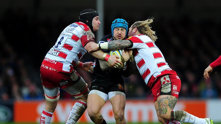 Jack Nowell of Exeter Chiefs is tackled by Ben Morgan of Gloucester and Richard Hibbard of Gloucester 