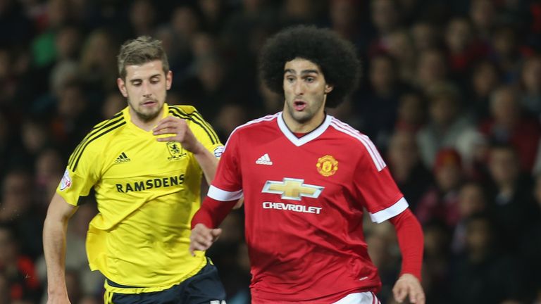 Jack Stephens battles with Marouane Fellaini during the Capital One Cup match this season