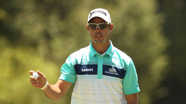 Jaco van Zyl of South Africa acknowledges the crowd on his final hole the 9th during the first round of the BMW South African Open Championship 