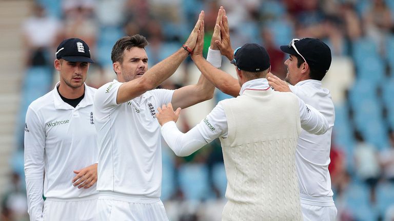 England's bowler Jimmy Anderson (2nd L) celebrates the dismissal of South African batsman Dean Elgar (not pictured) during day 3 of the fourth Test