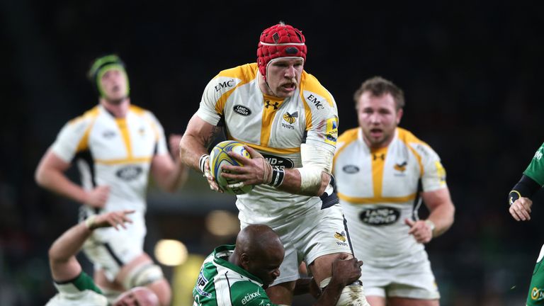 James Haskell of Wasps is held by Topsy Ojo during the Aviva Premiership match between London Irish and Wasps at Twickenham