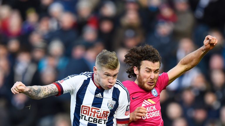 James McClean of West Bromwich Albion and Lawrie Wilson of Peterborough United compete for the ball during the Emirates FA Cup Fourth Round match
