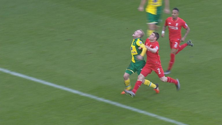 James Milner pushes Norwich forward Steven Naismith inside the penalty area