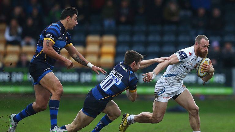 James Short breaks through the tackle of Tom Heathcote 