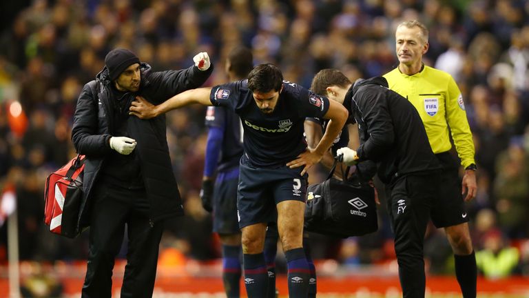 James Tomkins was forced off with a head injury after a clash with Joe Allen
