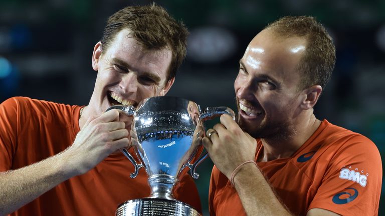 Britain's Jamie Murray (L) and Brazil's Bruno Soares pose with the trophy after victory in the Australian Open men's doubles