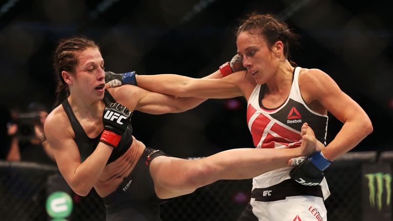 Joanna Jedrzejczyk of Poland (L) and Valerie Letourneau of Canada compete in their UFC women's strawweight championshi