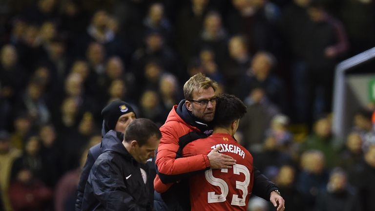 Liverpool manager Jurgen Klopp hugs Joao Teixeira