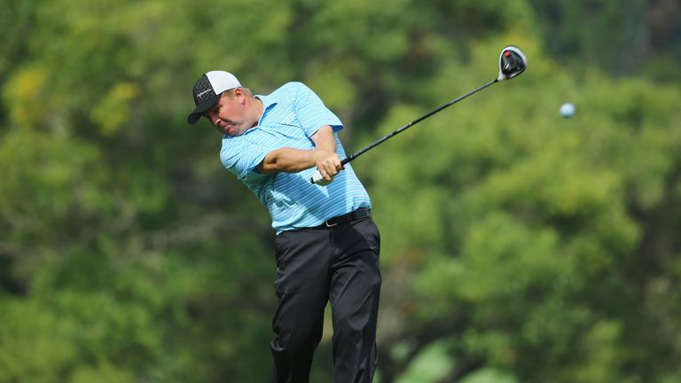 Ross McGowan of England tees off on the 9th hole on the West Course during day two of the Joburg Open