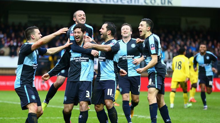 Joe Jacobson scored a penalty as Wycombe drew 1-1 with Aston Villa in the first tie at Adams Park