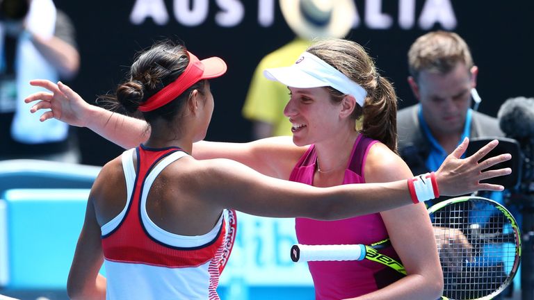 Konta and Zhang embrace after a match which now sees the Brit face Angelique Kerber of Germany