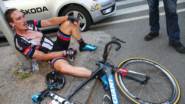 John Degenkolb of Germany and Team Giant-Alpecin rests on the pavement 