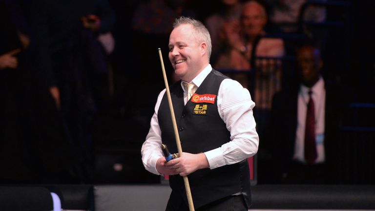 John Higgins smiles after beating Liang Wenbo during the Dafabet Masters 2016 