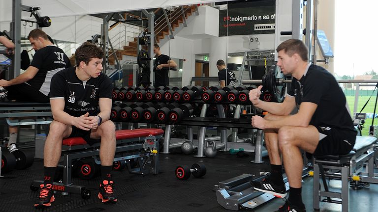 Steven Gerrard of Liverpool talks with Jon Flanagan 
