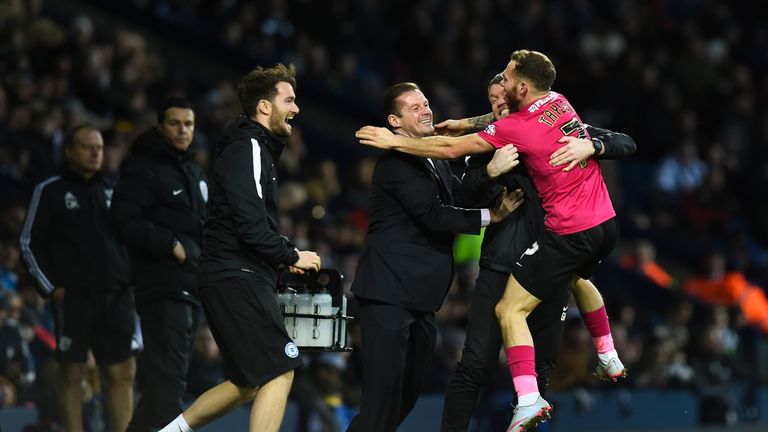 Peterborough's Jon Taylor celebrates his late equaliser with manager Graham Westley 