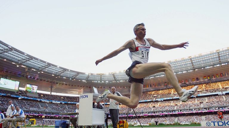 Jonathan Edwards of Great Britain flies through the air during the men's triple jump final at the 9th IAAF World Athletics Championship