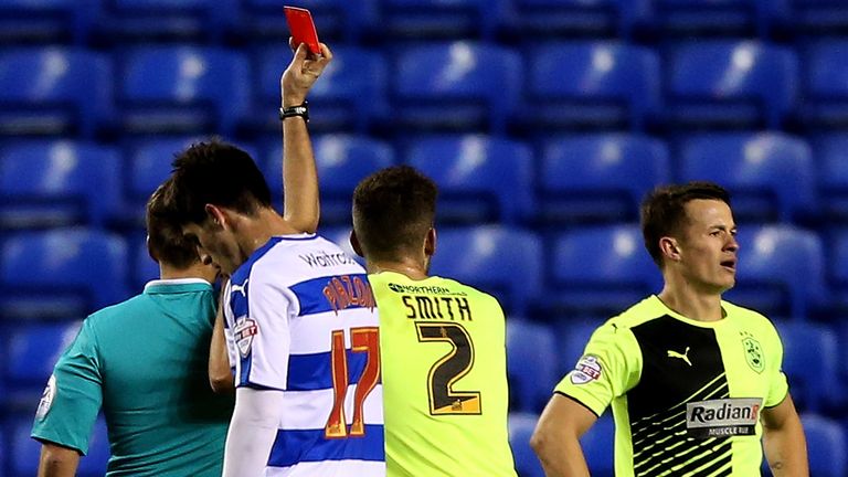 Jonathan Hogg of Huddersfield (R) is sent off by referee Oliver Langford