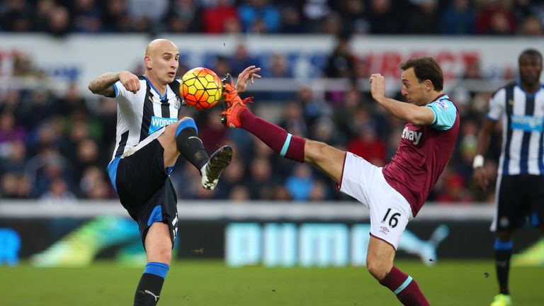 Jonjo Shelvey of Newcastle United and Mark Noble of West Ham United compete for the ball during the match between Newcastle and West Ham