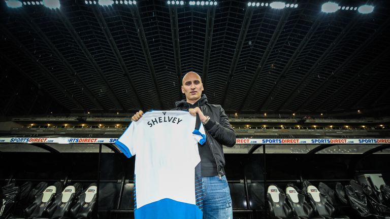 Newcastle's second January signing Jonjo Shelvey poses for photographs holding a Newcastle shirt with his name on the back at St James' Park