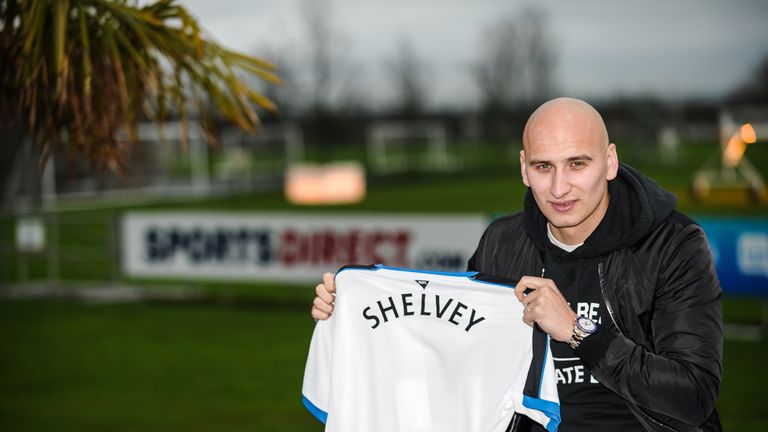 Newcastle's second January signing Jonjo Shelvey poses for photographs holding a Newcastle Shirt with his name on the back
