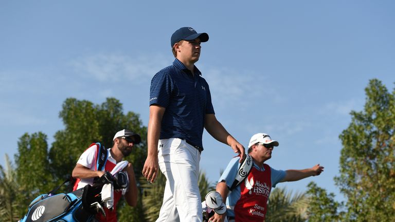 Jordan Spieth States leaves the second tee with caddie Michael Greller