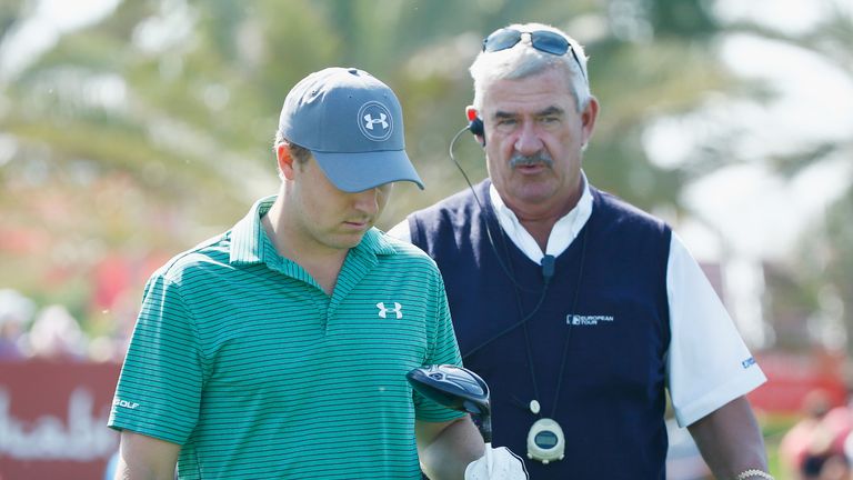 Jordan Spieth is informed of his monitoring penalty by chief referee John Paramor on the ninth tee