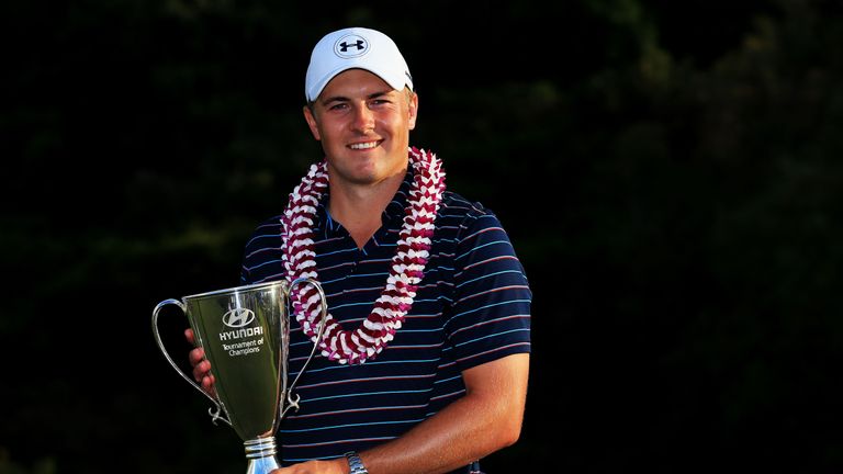 Jordan Spieth celebrates with the trophy after winning the Tournament of Champions in Hawaii