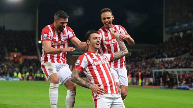 Joselu (centre) celebrates scoring Stoke's second goal against Norwich