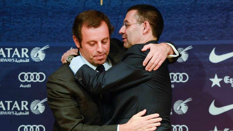 BARCELONA, SPAIN - JANUARY 23:  FCB Vice-President Josep Maria Bartomeu (R) hugs FCB President Sandro Rosell after the press conference announcing his resg