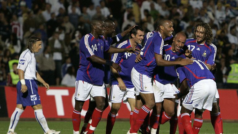 Faubert is mobbed by the likes of Thierry Henry and William Gallas after scoring on his first appearance for France in 2006