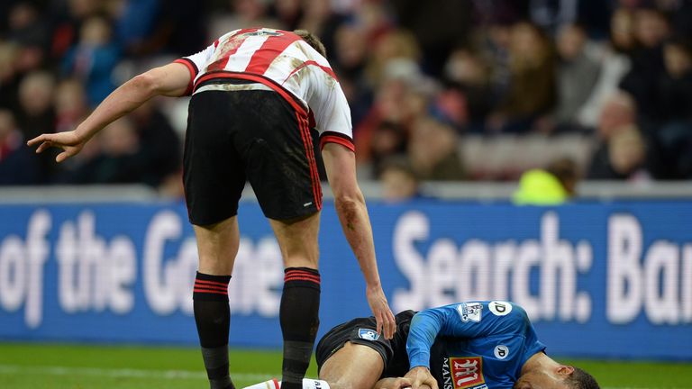 Junior Stanislas of Bournemouth lies on the ground injured against Sunderland