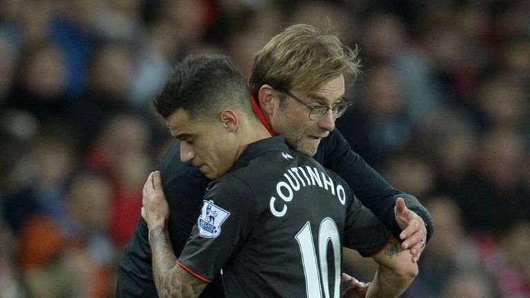 Liverpool's German manager Jurgen Klopp (R) hugs Liverpool's Brazilian midfielder Philippe Coutinho (L)