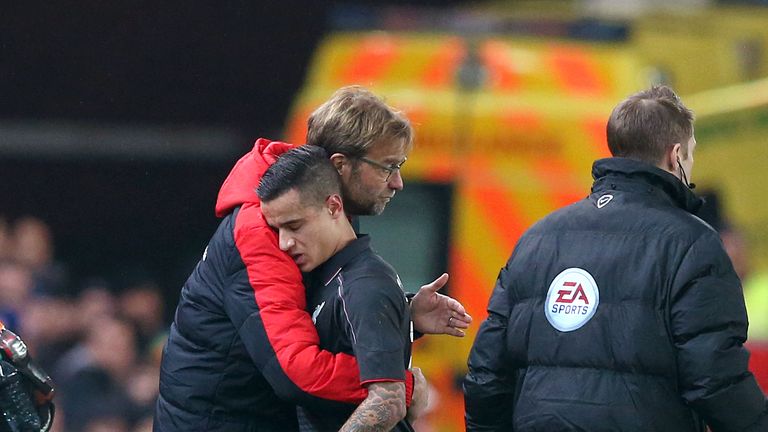 Liverpool's Philippe Coutinho is embraced by Jurgen Klopp as he leaves the field with an injury during the Capital One Cup, semi final, first leg v Stoke
