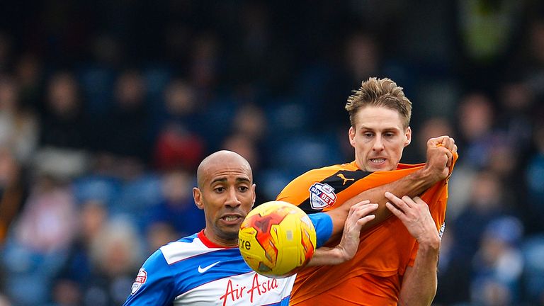 Karl Henry of Queens Park Rangers and David Edwards of Wolverhampton Wanderers battle for the ball