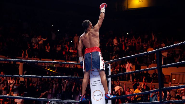Keith Thurman celebrates in the ring