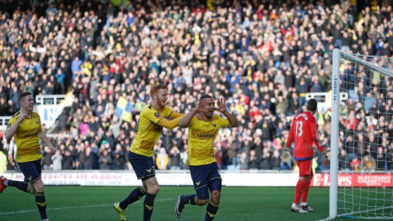 Oxford United's English midfielder Kemar Roofe (2R) celebrates scoring his team's second goal during the FA