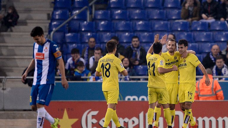 Villarreal's midfielder Manuel Trigueros (R) is congratulated by his teammates after scoring during the Spanish 