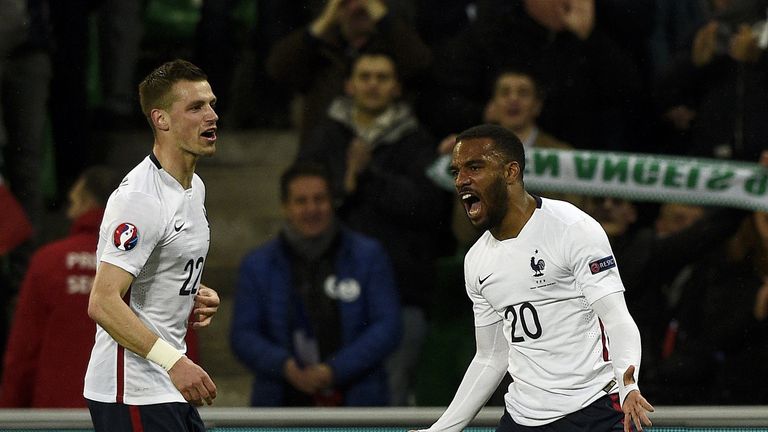 France forward Alexandre Lacazette (R) celebrates next to midfielder Morgan Schneiderlin after scoring a goal against Denmark