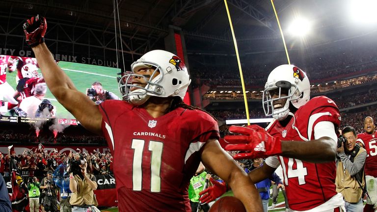 GLENDALE, AZ - JANUARY 16: Wide receiver Larry Fitzgerald #11 of the Arizona Cardinals celebrates his game winning touchdown in overtime with wide receiver