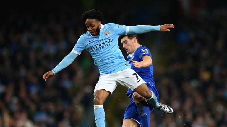 Raheem Sterling of Manchester City is tackled by Gareth Barry of Everton