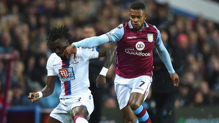 Pape N'Diaye Souare of Crystal Palace holds off Aston Villa's Leandro Bacuna 