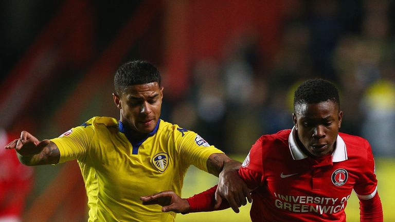 Liam Bridcutt of Leeds (left) competes for the ball against Charlton