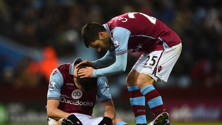 Libor Kozak of Aston Villa is assisted by team mate Carles Gil during the match against Crystal Palace