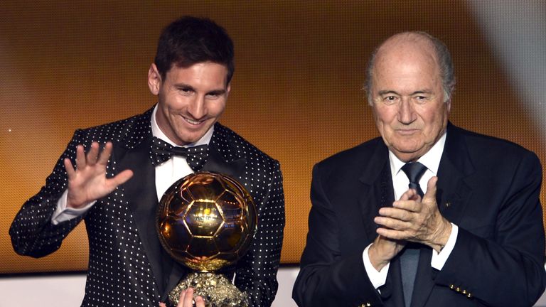 Lionel Messi receiving the Ballon d'Or trophy in 2013